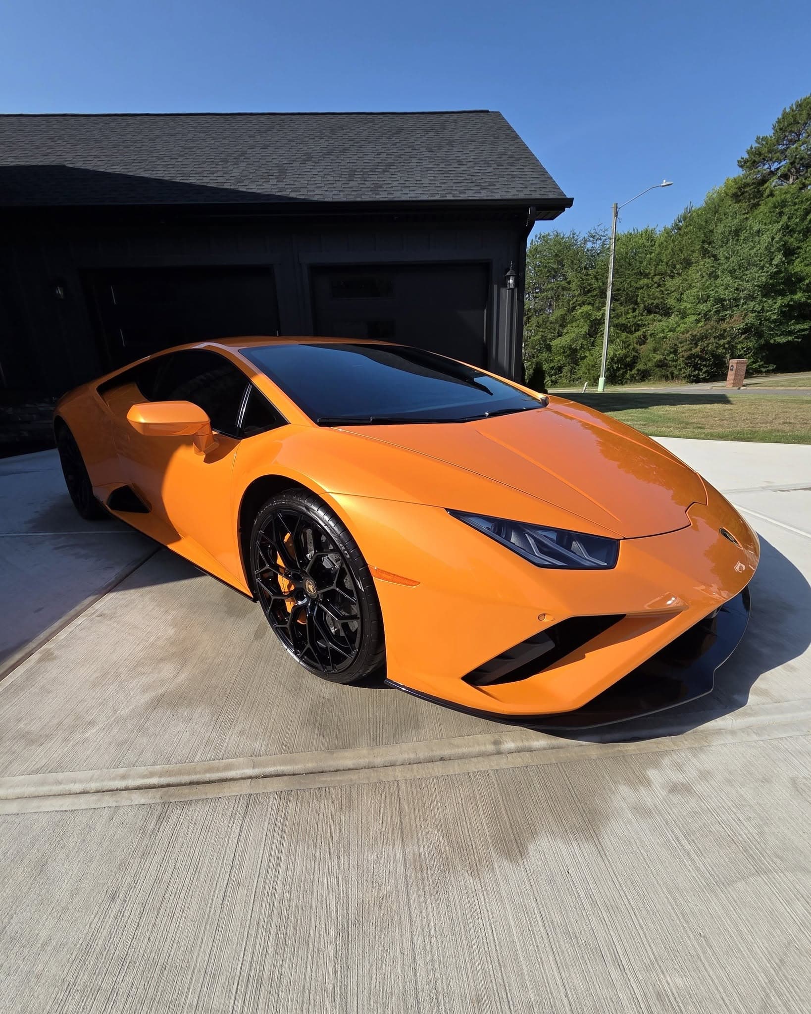 My Mobile Detailer technician detailing a customer's vehicle in a driveway